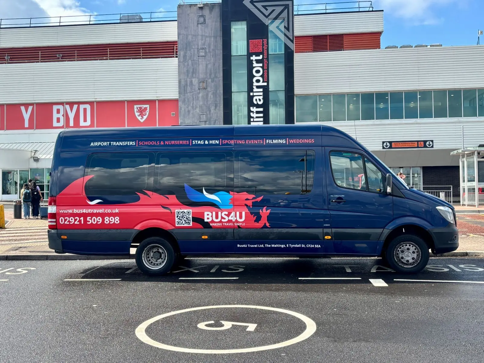Cardiff Airport Minibus Transfer - Bus4U Travel Bus4U 16 seater minibus outside Cardiff Airport terminal ready for an airport transfer